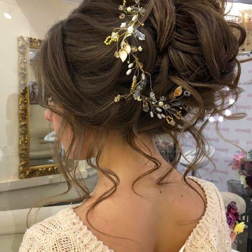 Undone Low Bun Bridal Hairstyles With Floral Headband (Photo 5 of 20)