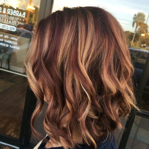Medium Length Curls Hairstyles With Caramel Highlights (Photo 16 of 20)