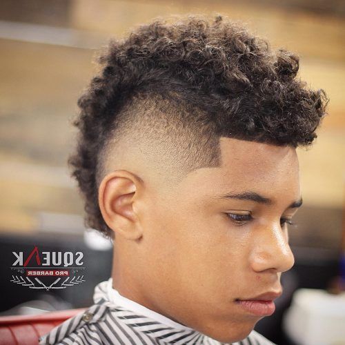 Mohawk Haircuts On Curls With Parting (Photo 12 of 20)