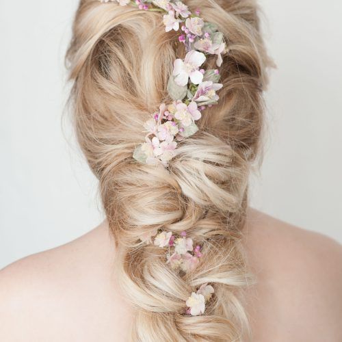 Undone Low Bun Bridal Hairstyles With Floral Headband (Photo 3 of 20)