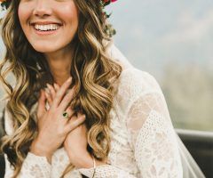 20 Ideas of Bohemian Curls Bridal Hairstyles with Floral Clip