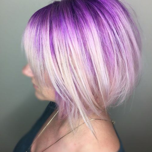 Voluminous Platinum And Purple Curls Blonde Hairstyles (Photo 3 of 20)
