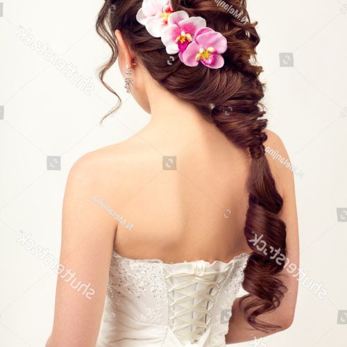 Curly Wedding Hairstyles With An Orchid (Photo 20 of 20)