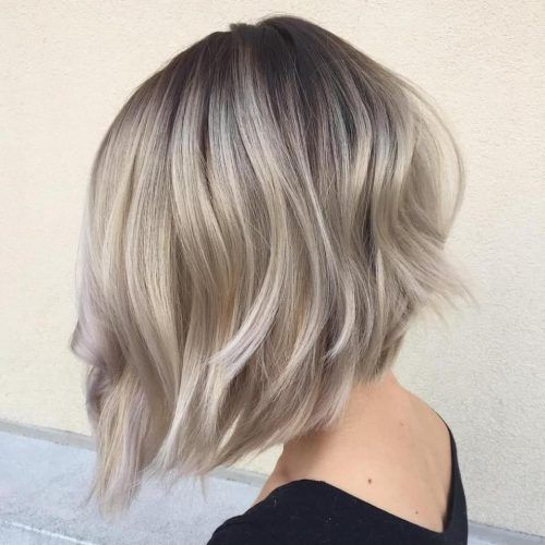 Curly Angled Blonde Bob Hairstyles (Photo 3 of 20)