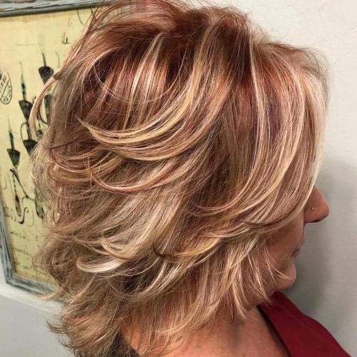 Feathered Cut Blonde Hairstyles With Middle Part (Photo 13 of 20)