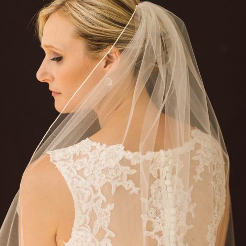 Side Curls Bridal Hairstyles With Tiara And Lace Veil (Photo 9 of 20)