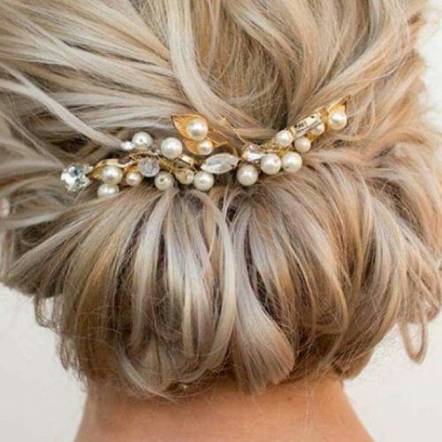 Sleek Bridal Hairstyles With Floral Barrette (Photo 20 of 20)