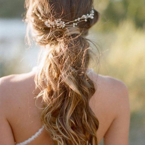 Bohemian Curls Bridal Hairstyles With Floral Clip (Photo 6 of 20)