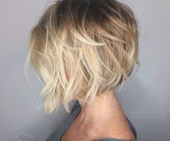 20 Ideas of Curly Ash Blonde Updo Hairstyles with Bouffant and Bangs