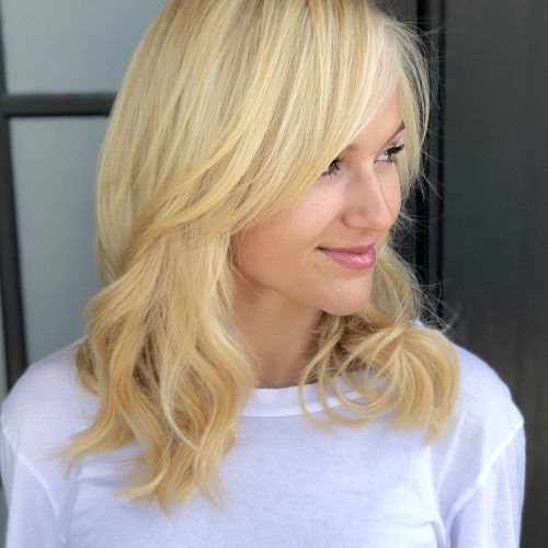 Wispy Layered Blonde Haircuts With Bangs (Photo 12 of 20)