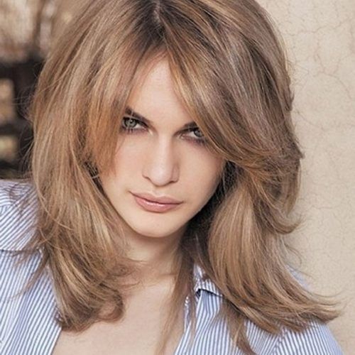 Medium Hairstyles With Perky Feathery Layers (Photo 17 of 20)
