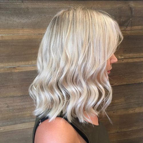 Creamy Blonde Waves With Bangs (Photo 6 of 20)