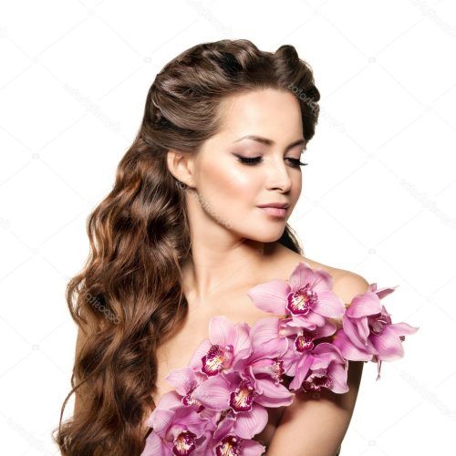 Curly Wedding Hairstyles With An Orchid (Photo 6 of 20)