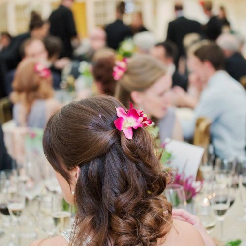 Curly Wedding Hairstyles With An Orchid (Photo 10 of 20)