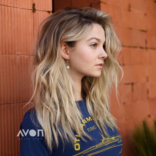 Layered With A Flip For Long Hairstyles (Photo 16 of 20)