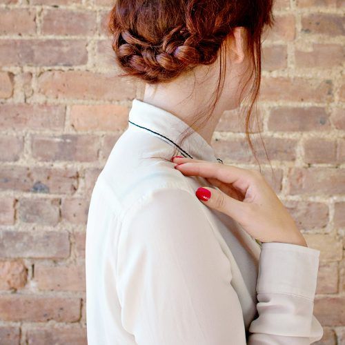 Low Braided Bun With A Side Braid (Photo 11 of 15)