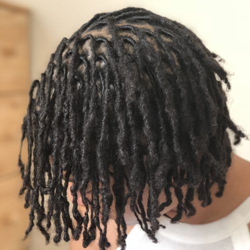 Tightly Coiled Gray Dreads Bun Hairstyles (Photo 6 of 20)