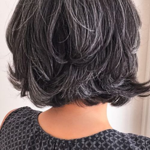 Short Loose Curls Hairstyles With Subtle Ashy Highlights (Photo 14 of 20)
