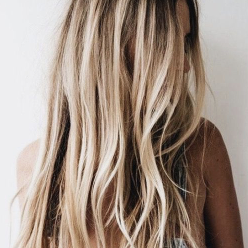 Salty Beach Blonde Layers Hairstyles (Photo 15 of 20)