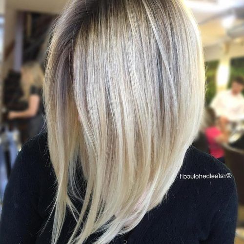 Striking Angled Platinum Lob Blonde Hairstyles (Photo 6 of 20)