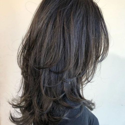 Long Black Haircuts With Light Flipped Up Ends (Photo 1 of 20)