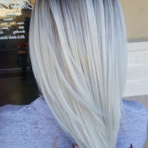 Dark Roots And Icy Cool Ends Blonde Hairstyles (Photo 9 of 20)