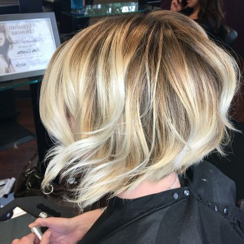 Pearl Blonde Bouncy Waves Hairstyles (Photo 1 of 20)