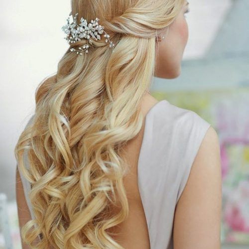 Twisted And Pinned Half Up Wedding Hairstyles (Photo 3 of 20)