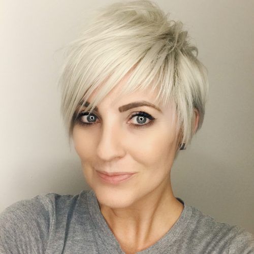 Flipped Up Platinum Blonde Pixie Haircuts (Photo 14 of 20)
