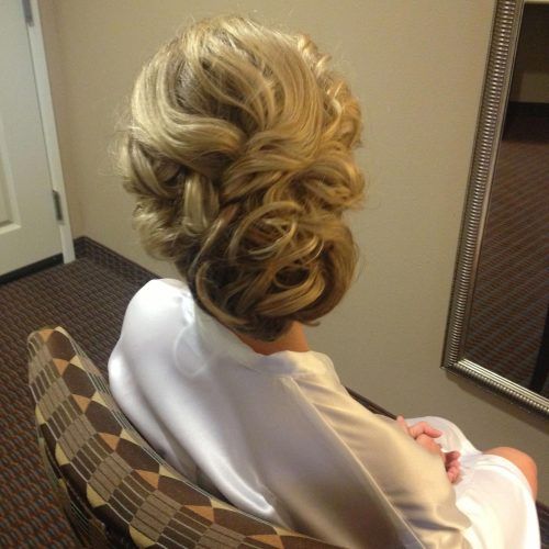 Voluminous Chignon Wedding Hairstyles With Twists (Photo 14 of 20)