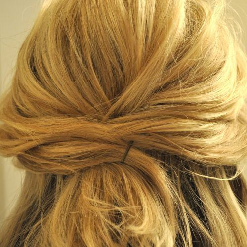 Twisted And Pinned Half Up Wedding Hairstyles (Photo 10 of 20)