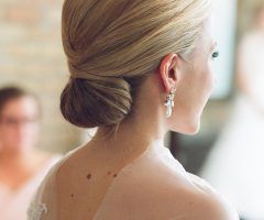 20 Best Collection of Sleek Low Bun Rosy Outlook Wedding Updos