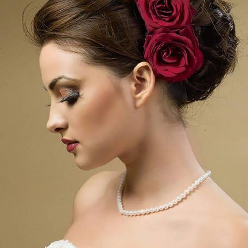 Curly Wedding Hairstyles With An Orchid (Photo 2 of 20)