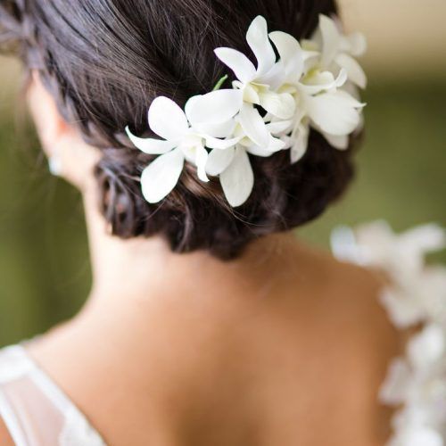 Curly Wedding Hairstyles With An Orchid (Photo 3 of 20)