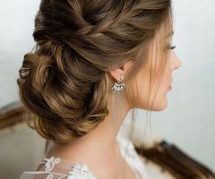 20 Photos Chignon Wedding Hairstyles with Pinned Up Embellishment