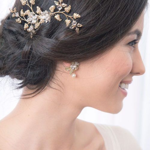 Sleek Bridal Hairstyles With Floral Barrette (Photo 15 of 20)