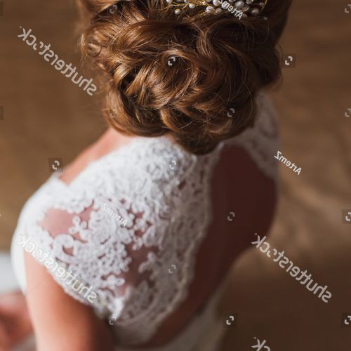 Curly Wedding Updos With Flower Barrette Ties (Photo 19 of 20)