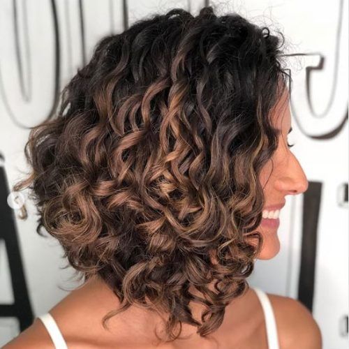 Layered Curly Medium Length Hairstyles (Photo 15 of 20)