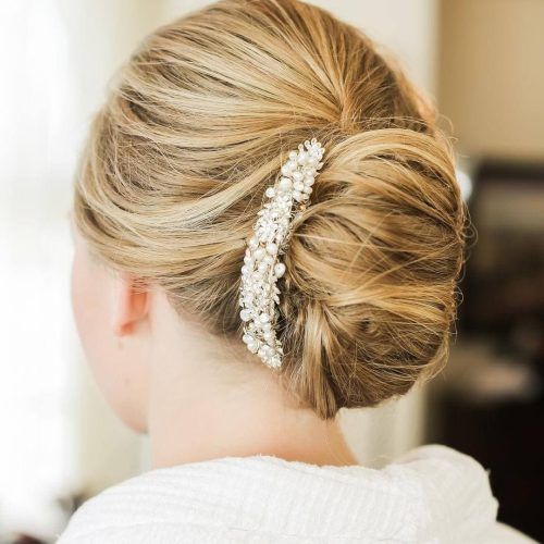 Undone Low Bun Bridal Hairstyles With Floral Headband (Photo 6 of 20)